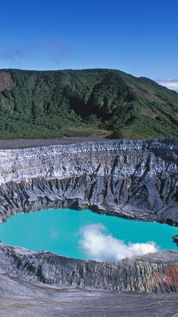Body of Water Between Mountain Under Blue Sky During Daytime. Wallpaper in 750x1334 Resolution