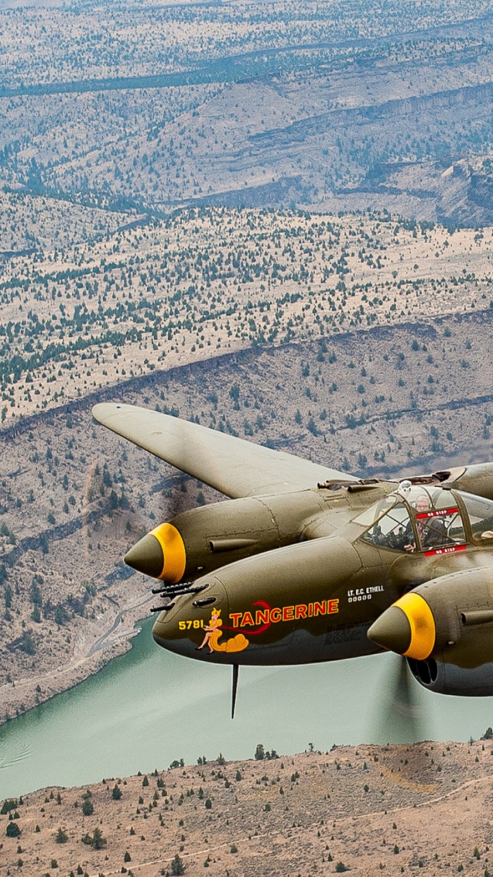 Gray Fighter Jet Flying Over The Mountain During Daytime. Wallpaper in 720x1280 Resolution