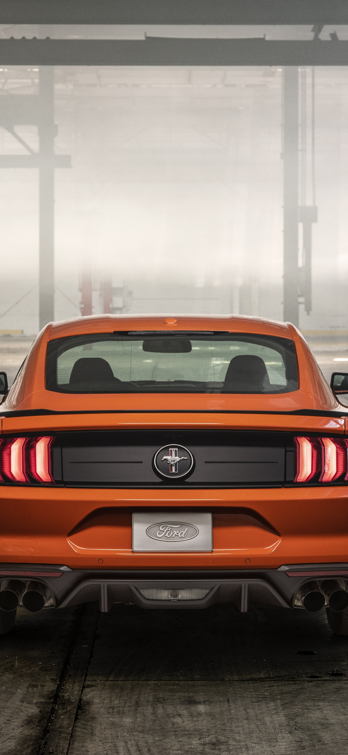 Red Chevrolet Camaro in a Parking Lot. Wallpaper in 1125x2436 Resolution