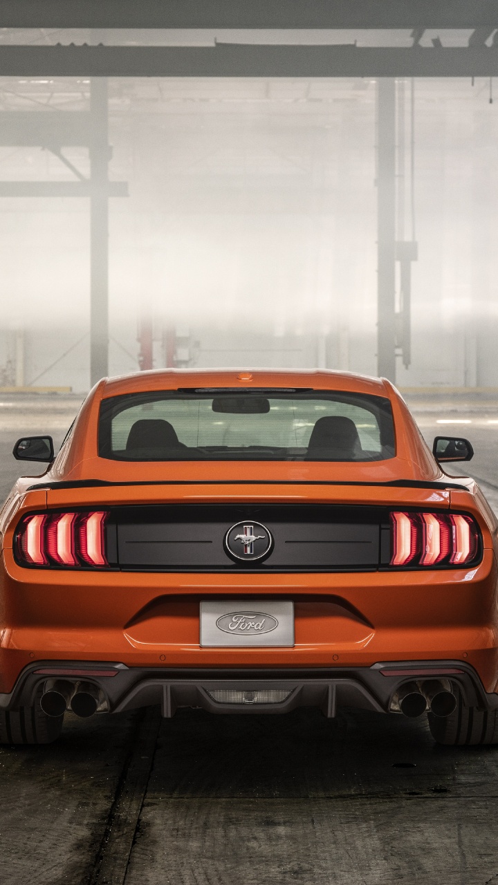 Red Chevrolet Camaro in a Parking Lot. Wallpaper in 720x1280 Resolution