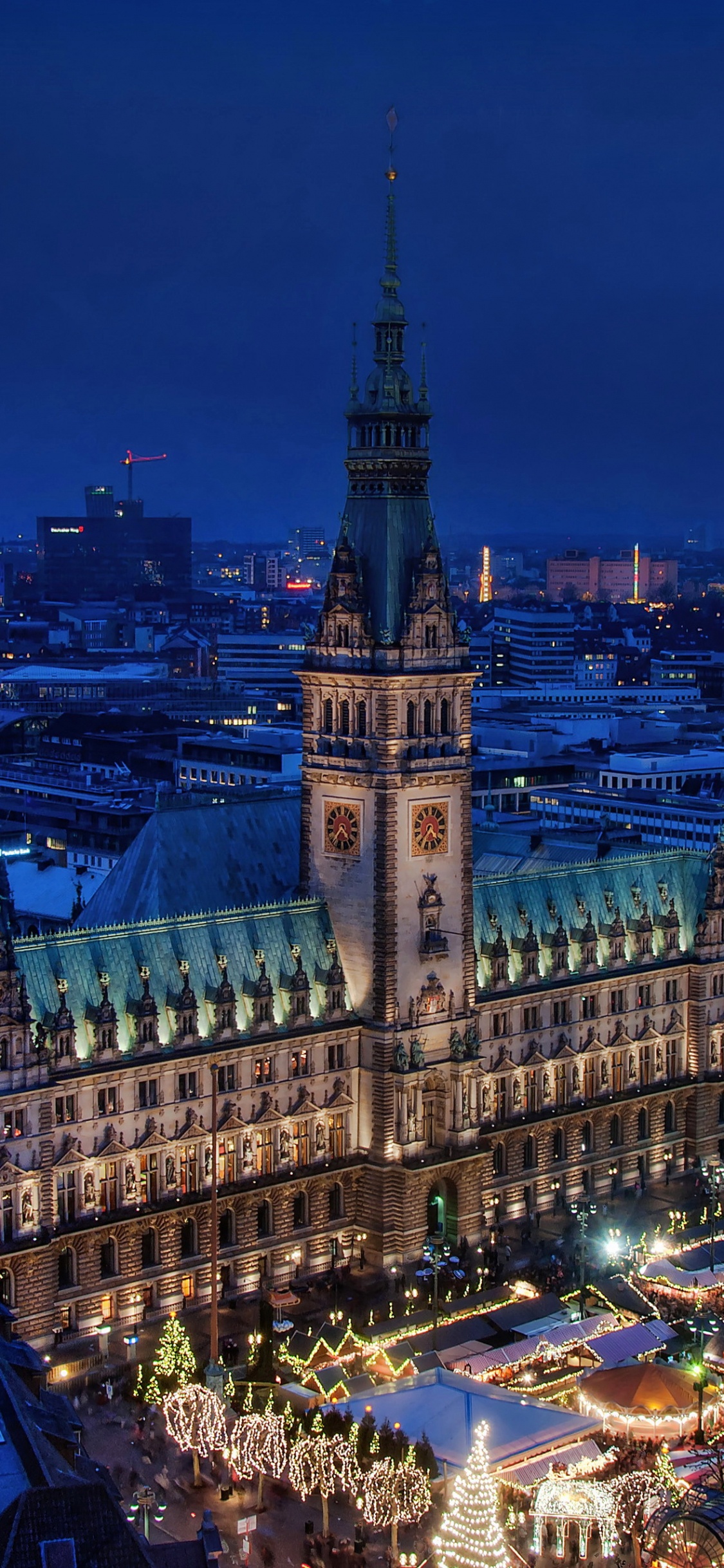 Aerial View of City Buildings During Night Time. Wallpaper in 1125x2436 Resolution
