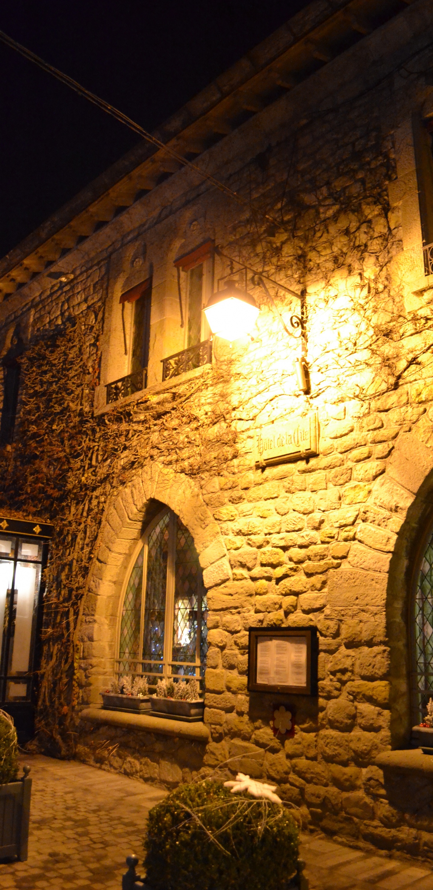 Brown Brick Building With Light Turned on During Night Time. Wallpaper in 1440x2960 Resolution