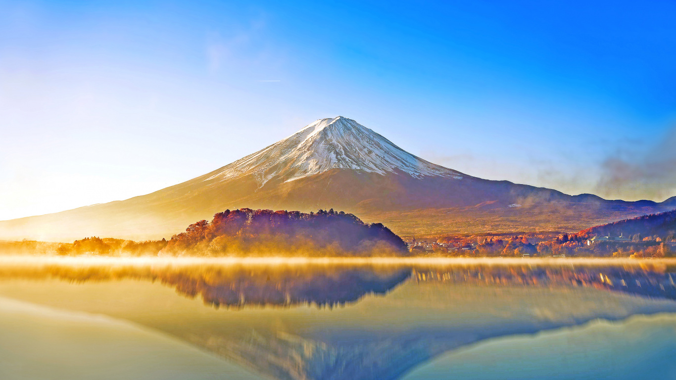 Lake Near Mountain Under Blue Sky During Daytime. Wallpaper in 1366x768 Resolution