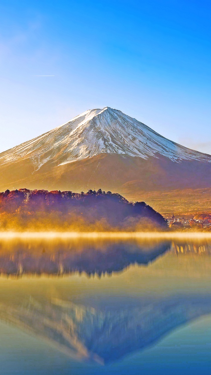 Lake Near Mountain Under Blue Sky During Daytime. Wallpaper in 720x1280 Resolution