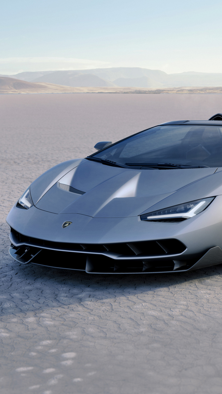 Porsche 911 Negro Sobre Arena Gris Durante el Día. Wallpaper in 750x1334 Resolution