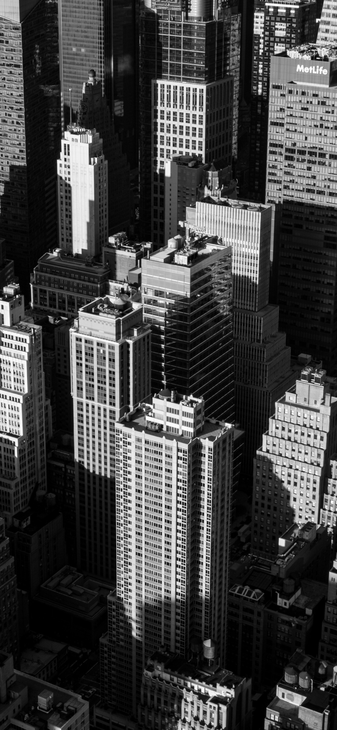 Grayscale Photo of City Buildings. Wallpaper in 1125x2436 Resolution