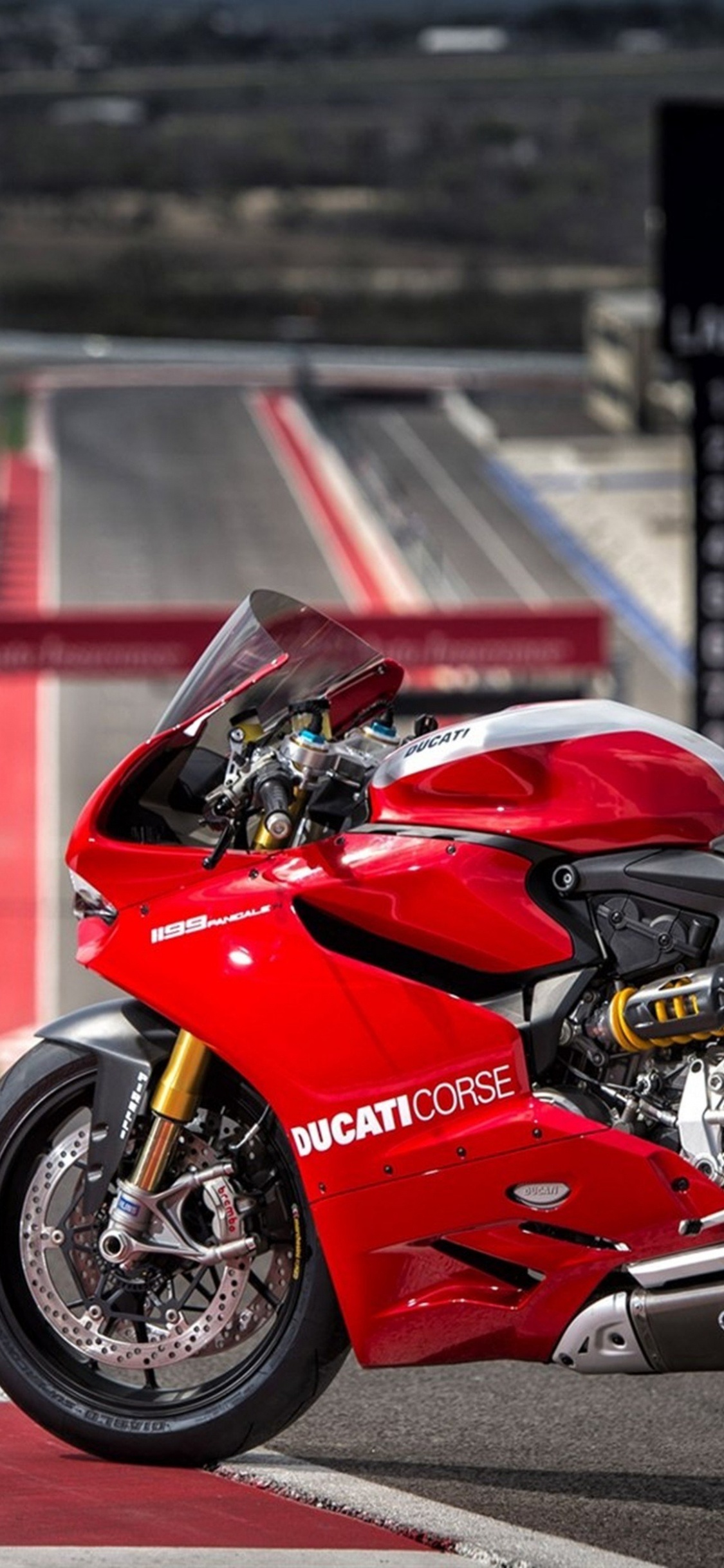 Red and Black Sports Bike. Wallpaper in 1125x2436 Resolution