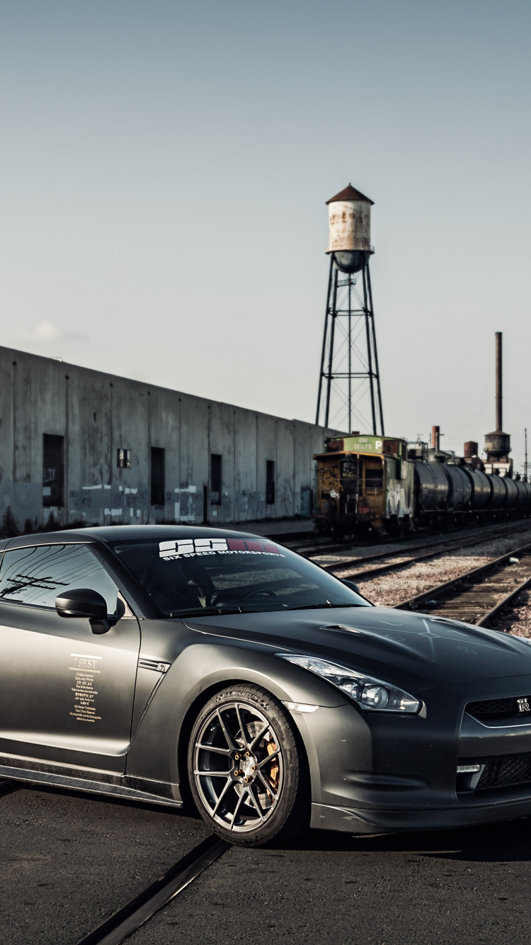 Black Porsche 911 Parked on Road During Daytime. Wallpaper in 750x1334 Resolution