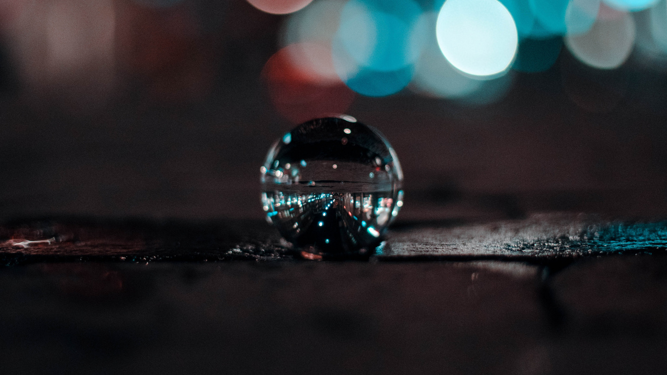 Water Drop on Black Surface. Wallpaper in 1366x768 Resolution
