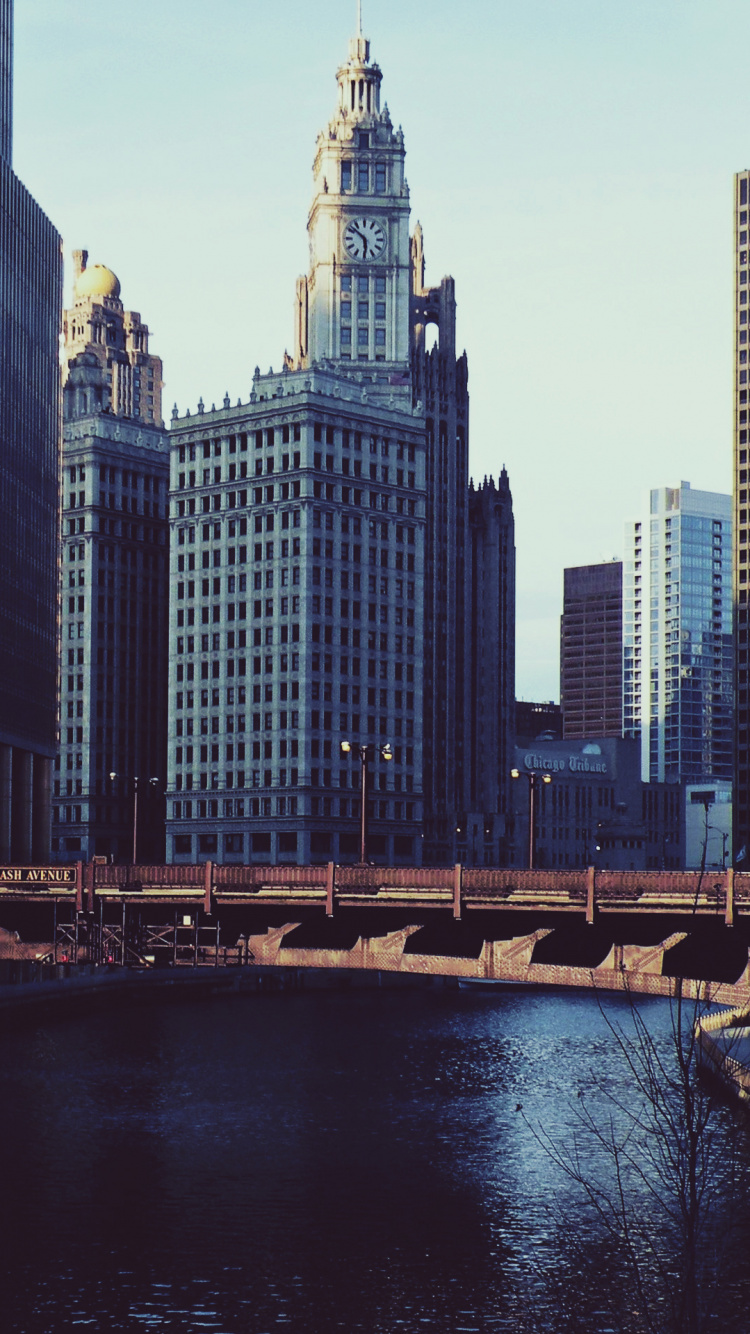 Body of Water Near City Buildings During Daytime. Wallpaper in 750x1334 Resolution