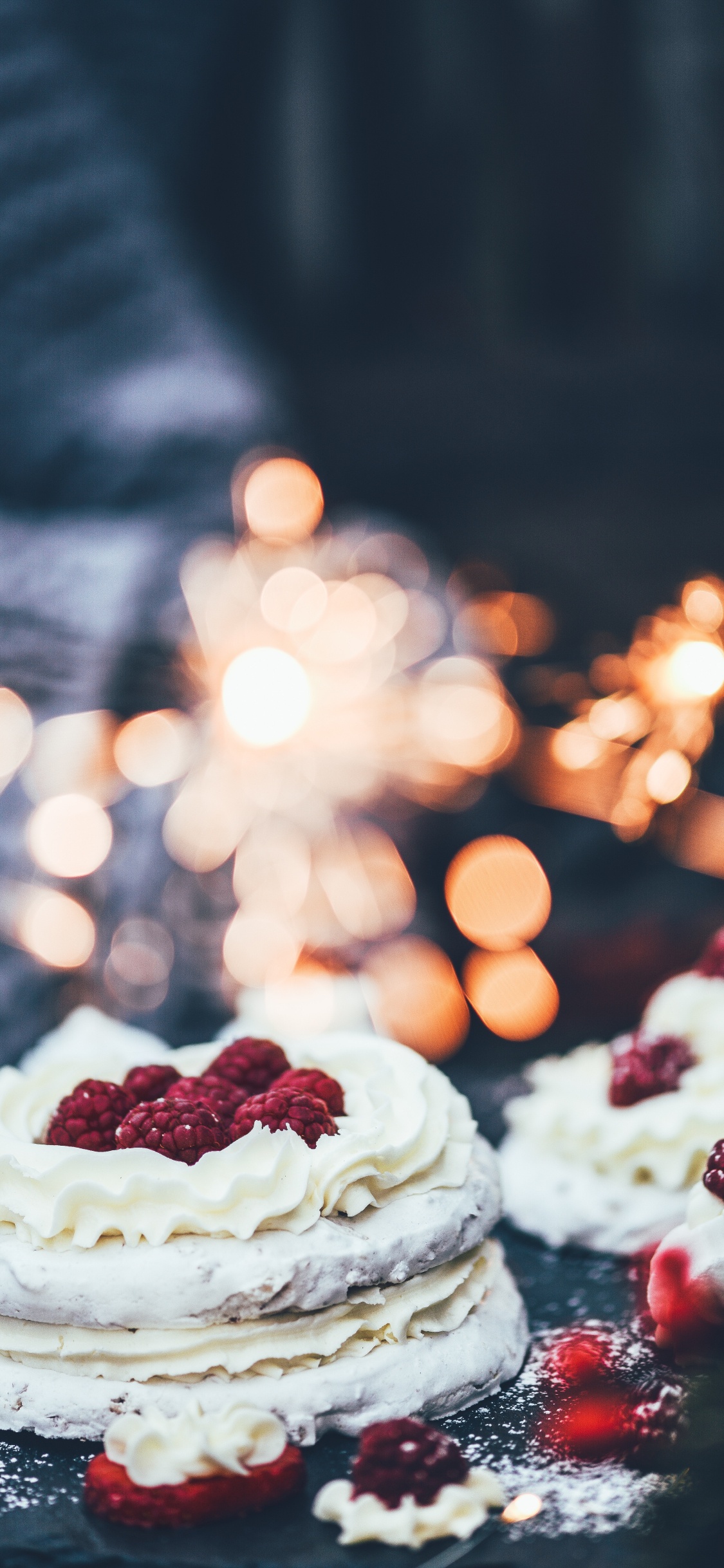White and Red Cake With Red and White Sprinkles on Top. Wallpaper in 1125x2436 Resolution