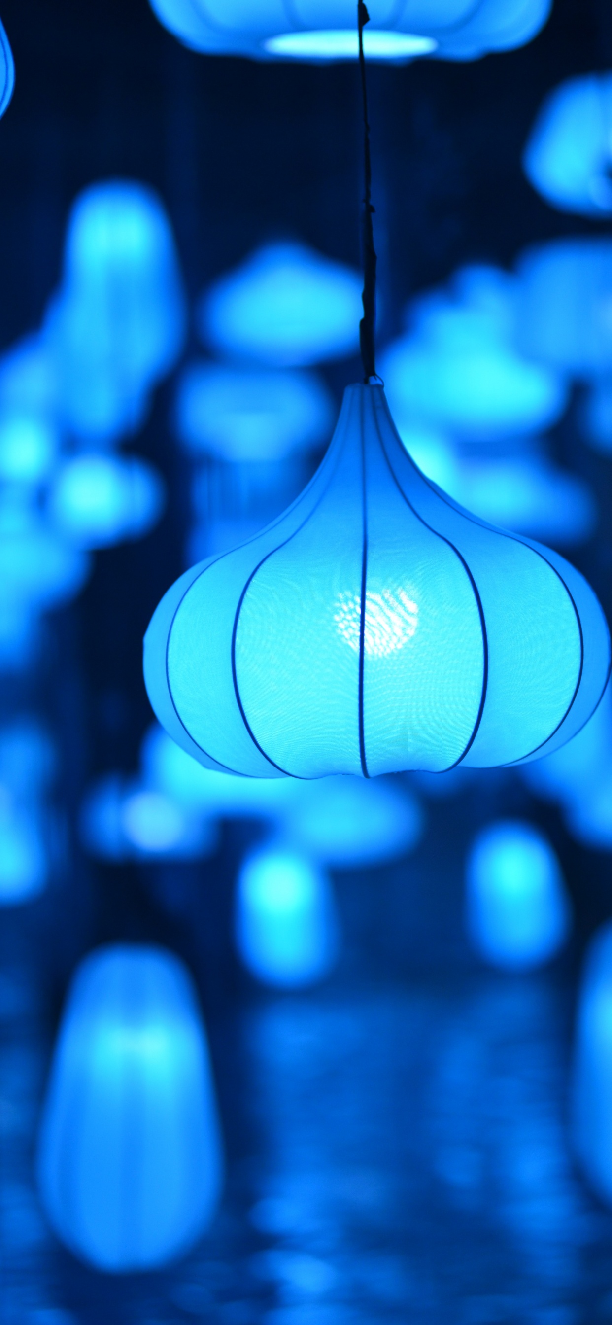 White Pendant Lamp Turned on During Night Time. Wallpaper in 1242x2688 Resolution