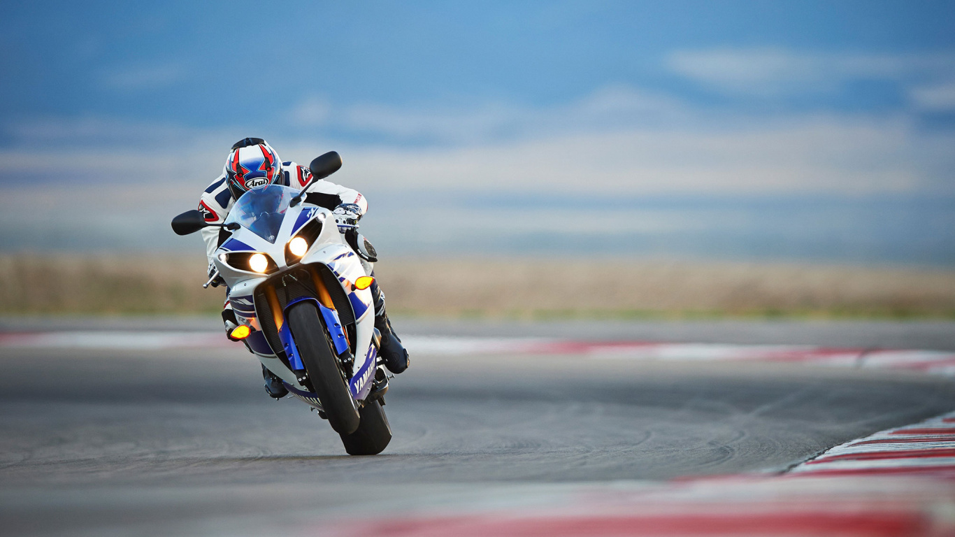 Man Riding on Yellow and White Sports Bike. Wallpaper in 1366x768 Resolution