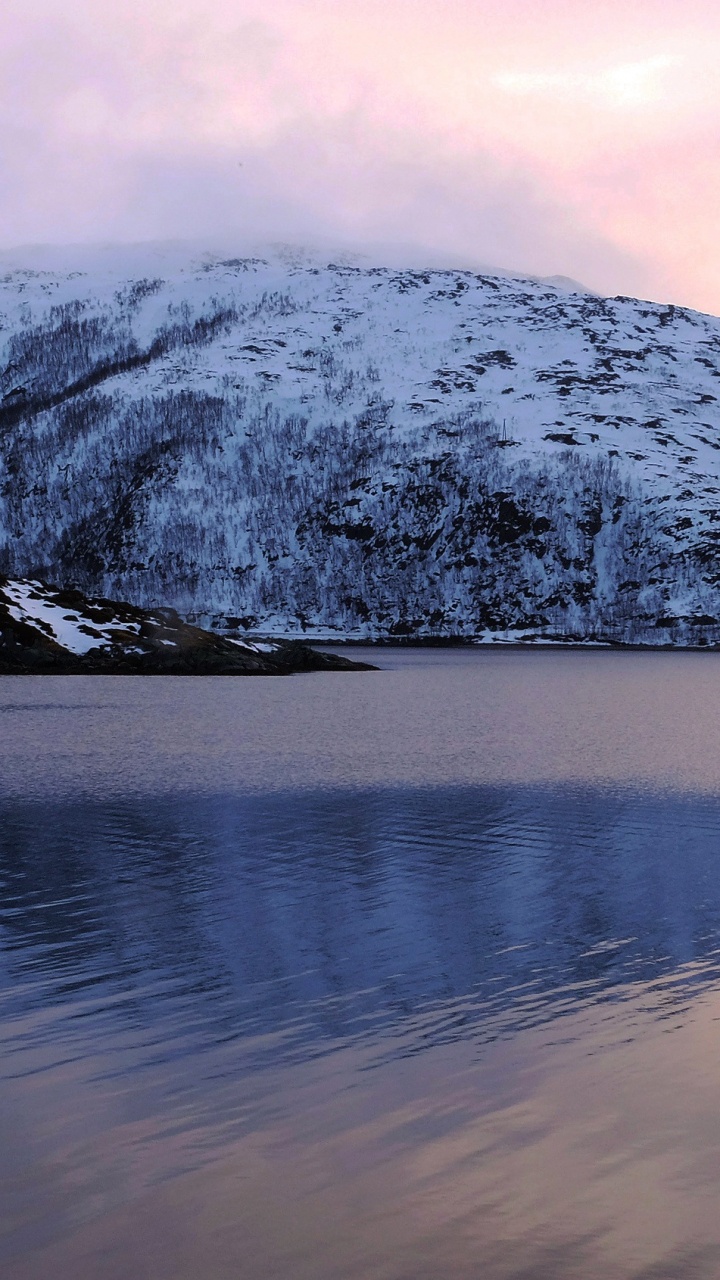 Snow Covered Mountain Near Body of Water During Daytime. Wallpaper in 720x1280 Resolution