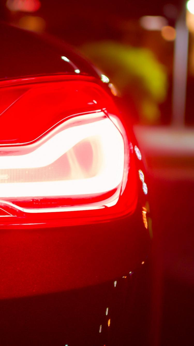 Red Car in Tilt Shift Lens. Wallpaper in 750x1334 Resolution