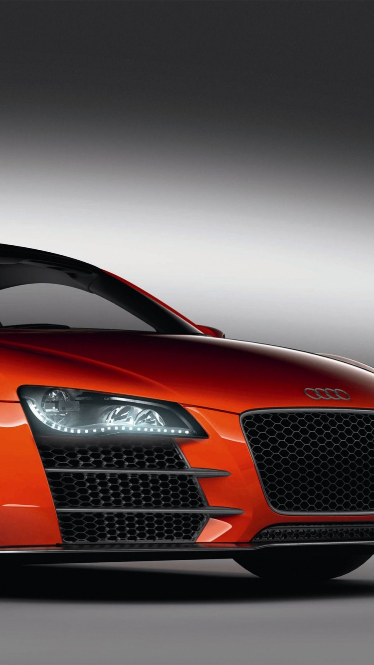 Coupé Audi Rouge Dans Une Salle Blanche. Wallpaper in 750x1334 Resolution