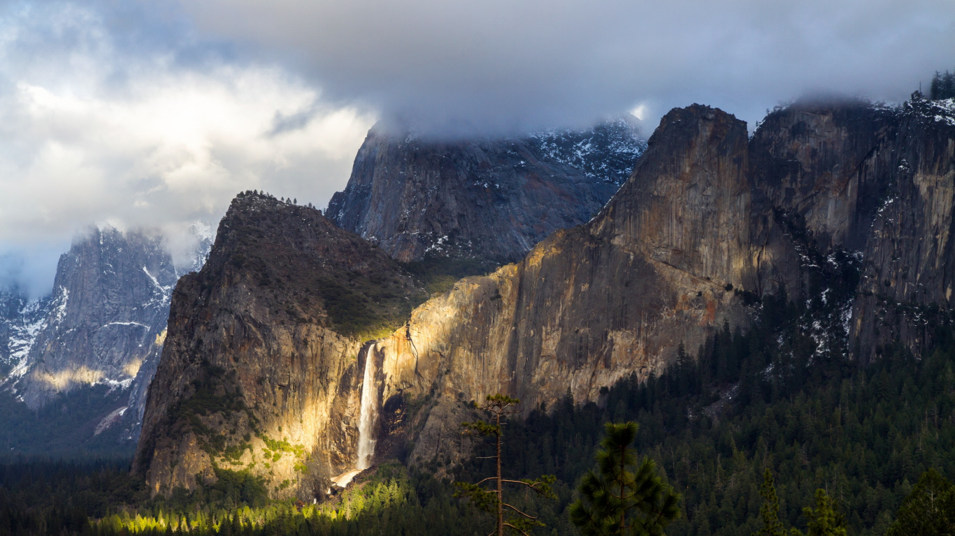 Green Trees Near Brown Mountain Under White Clouds During Daytime. Wallpaper in 1366x768 Resolution