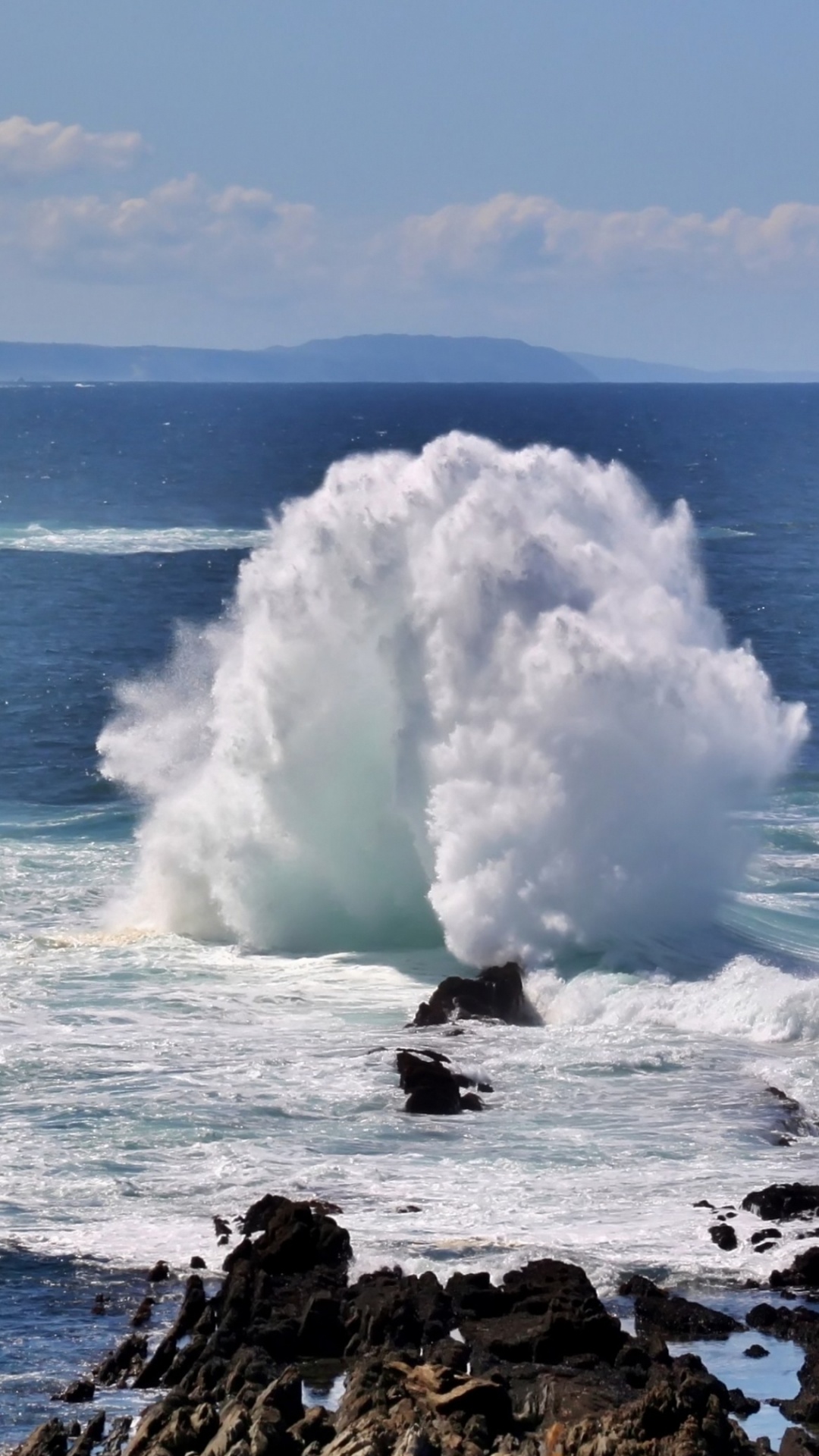 White Sea Waves Crashing on Black Rock Formation Under Blue Sky During Daytime. Wallpaper in 1080x1920 Resolution