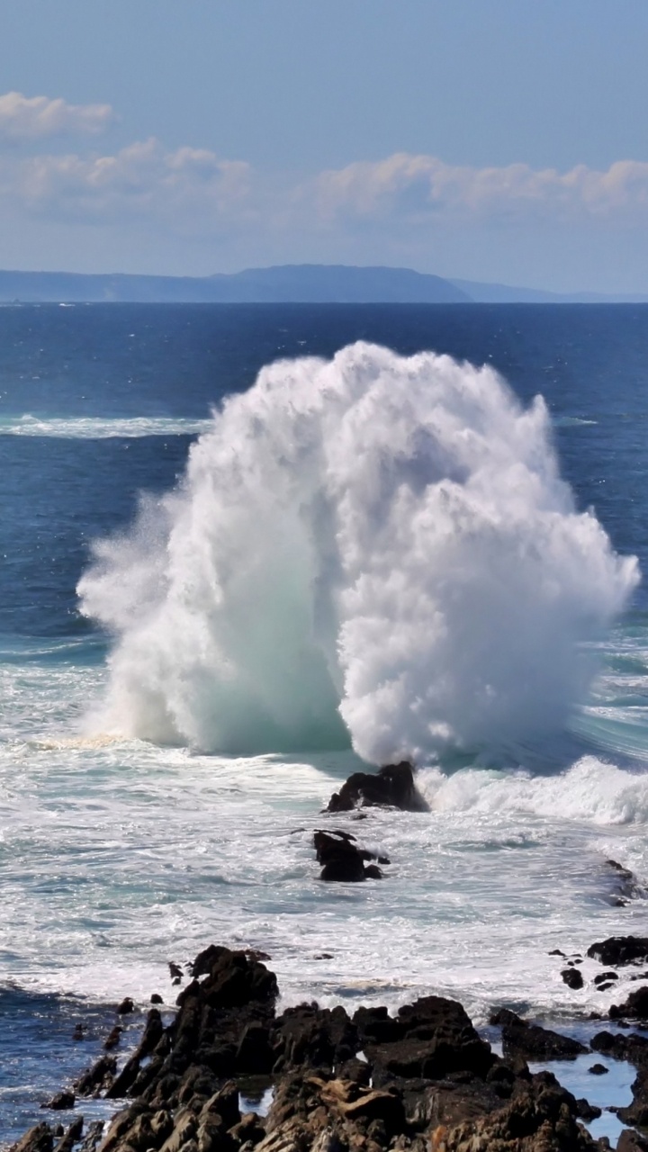 White Sea Waves Crashing on Black Rock Formation Under Blue Sky During Daytime. Wallpaper in 720x1280 Resolution