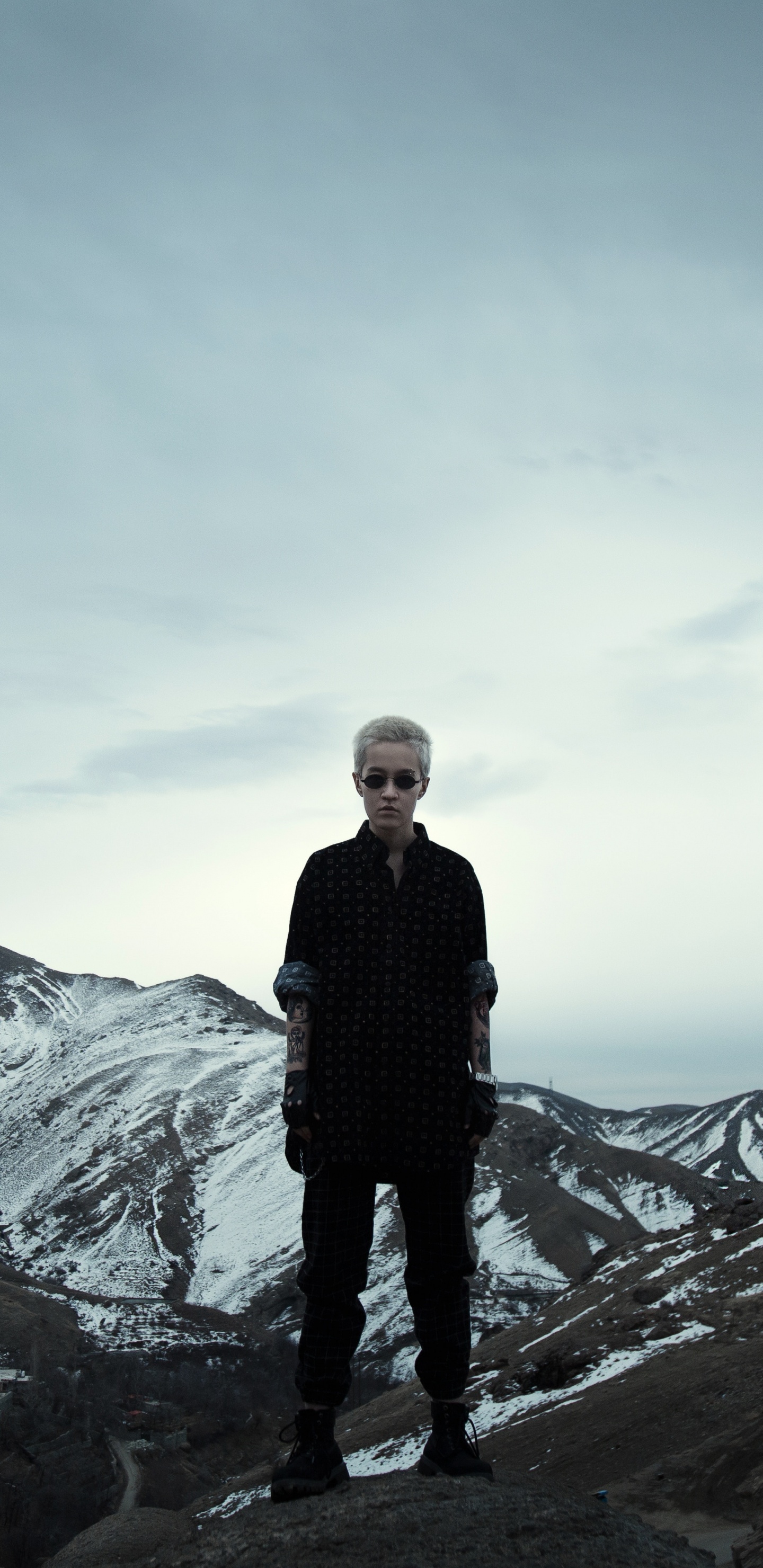 Man in Black Jacket Standing on Rock Formation During Daytime. Wallpaper in 1440x2960 Resolution