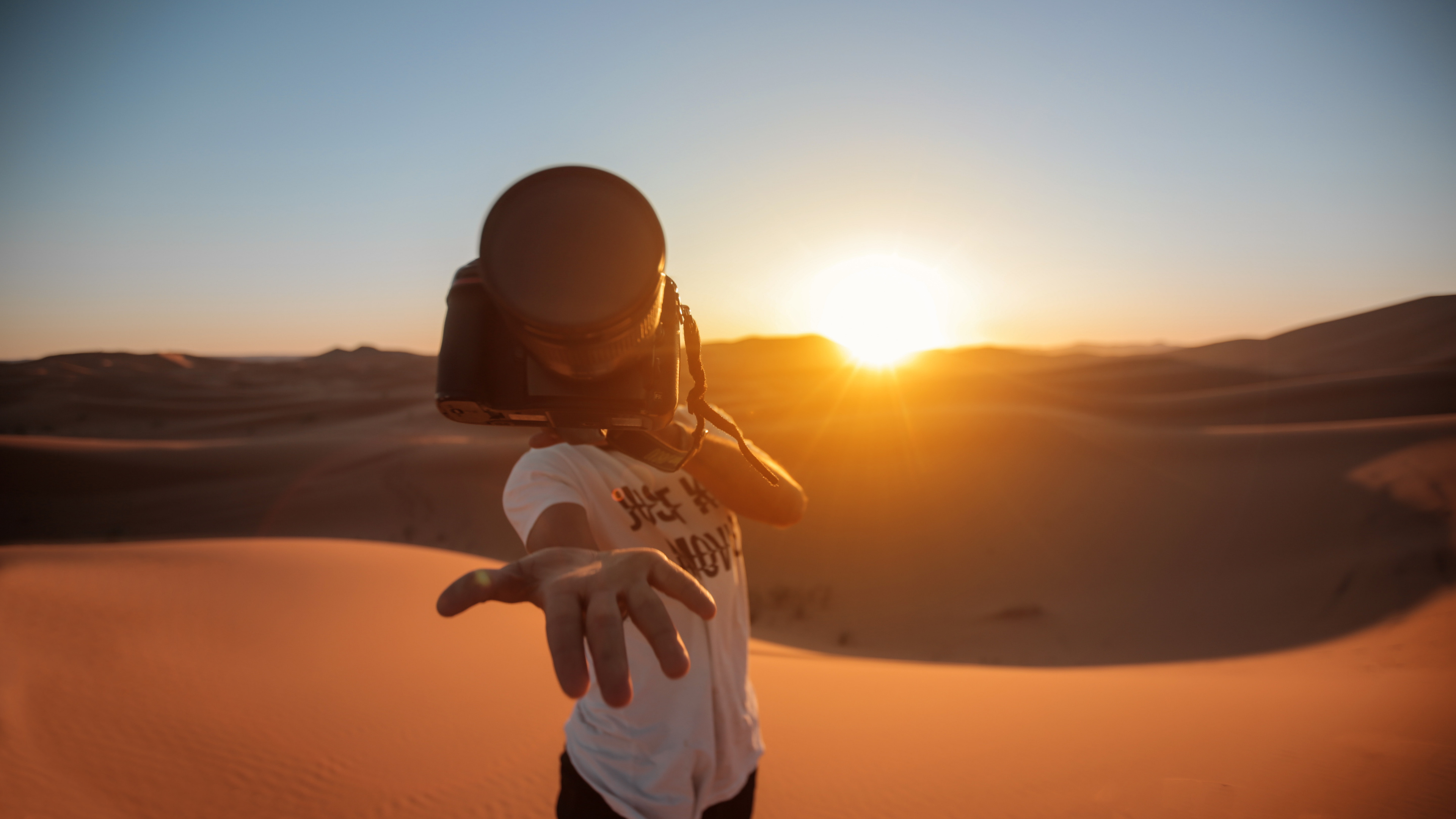 Man in White Shirt and Black Pants Standing on Sand During Sunset. Wallpaper in 3840x2160 Resolution