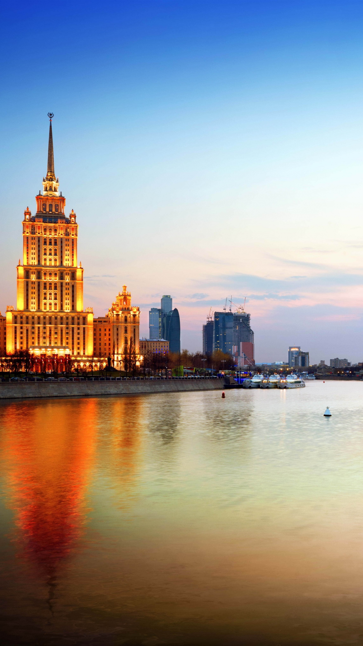 City Skyline Across Body of Water During Daytime. Wallpaper in 1440x2560 Resolution