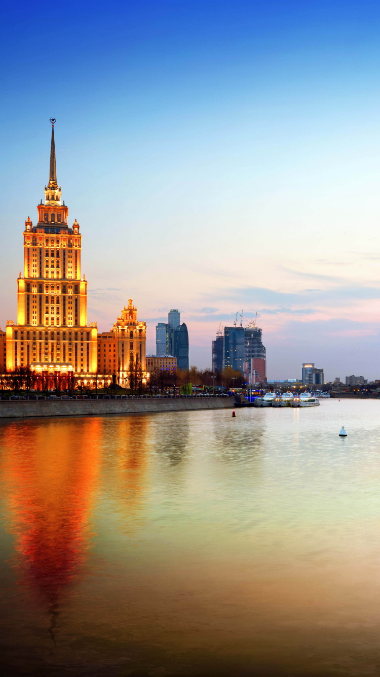 City Skyline Across Body of Water During Daytime. Wallpaper in 750x1334 Resolution
