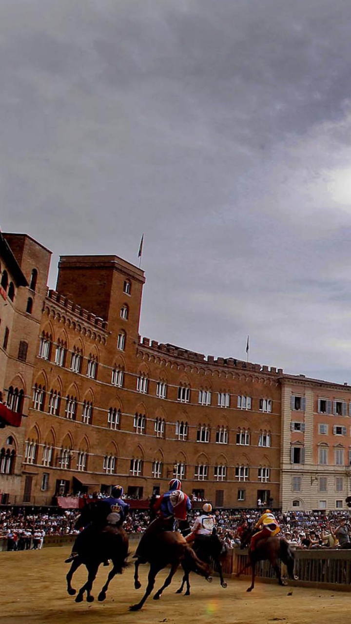 People Walking on Street Near Brown Concrete Building During Daytime. Wallpaper in 720x1280 Resolution