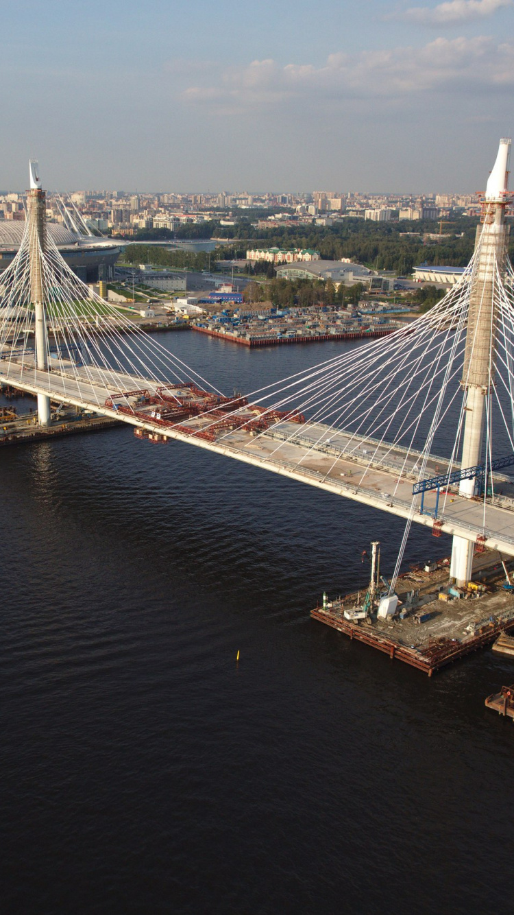 White Bridge Over Body of Water During Daytime. Wallpaper in 750x1334 Resolution