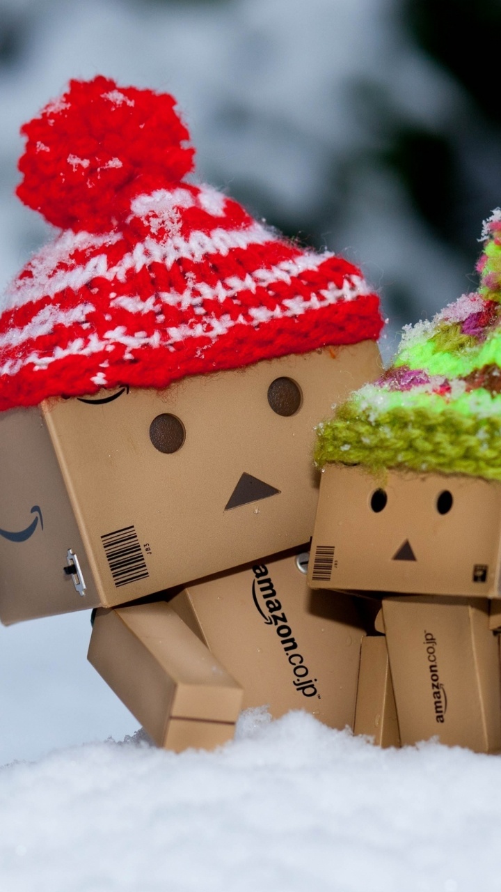 Brown Cardboard Box With Red and Green Ribbon on White Snow. Wallpaper in 720x1280 Resolution