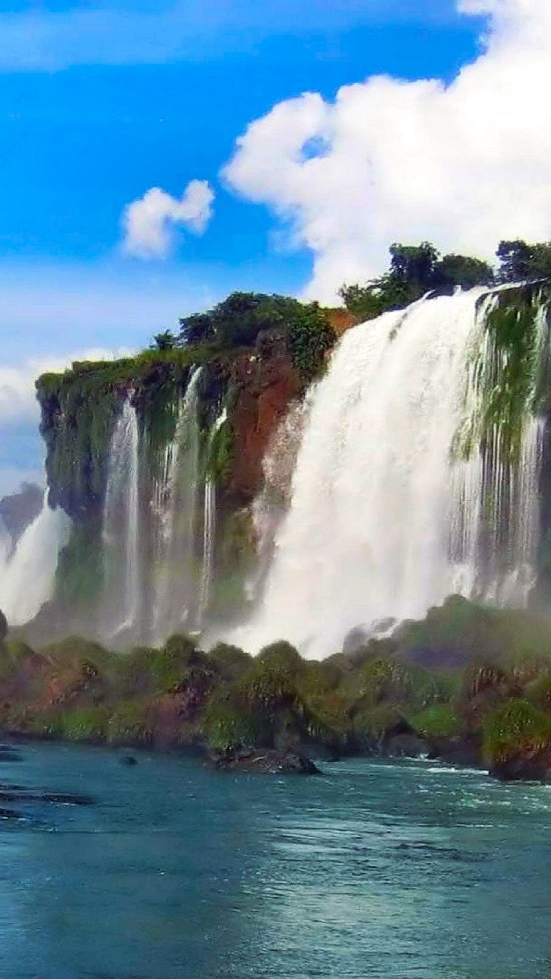 Cascadas Cerca de Árboles Verdes Bajo un Cielo Azul Durante el Día. Wallpaper in 1080x1920 Resolution