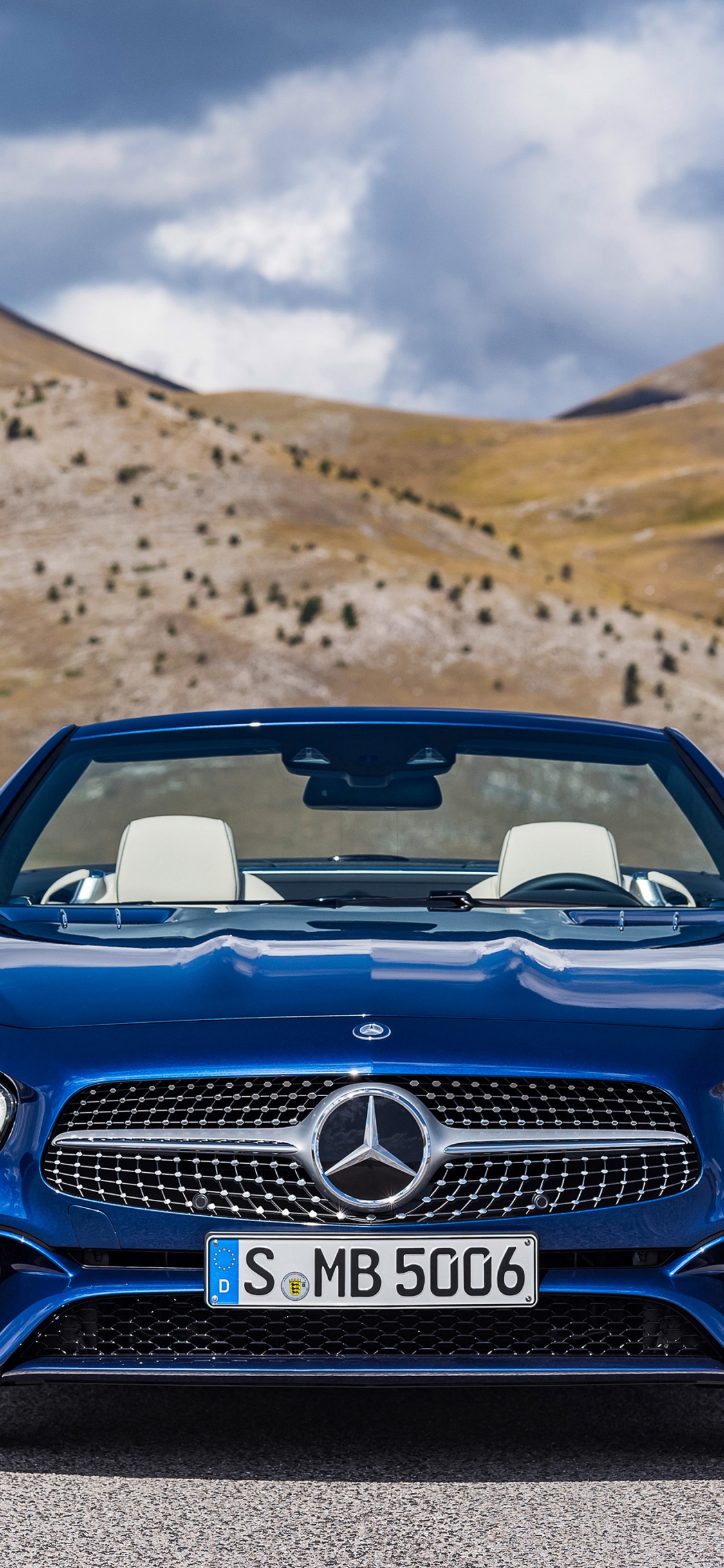 Blue Bmw Car on Road During Daytime. Wallpaper in 1125x2436 Resolution