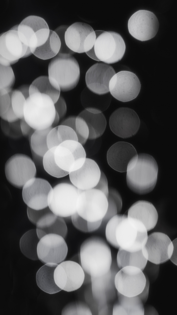 Weiße Und Schwarze Bokeh-Lichter. Wallpaper in 750x1334 Resolution
