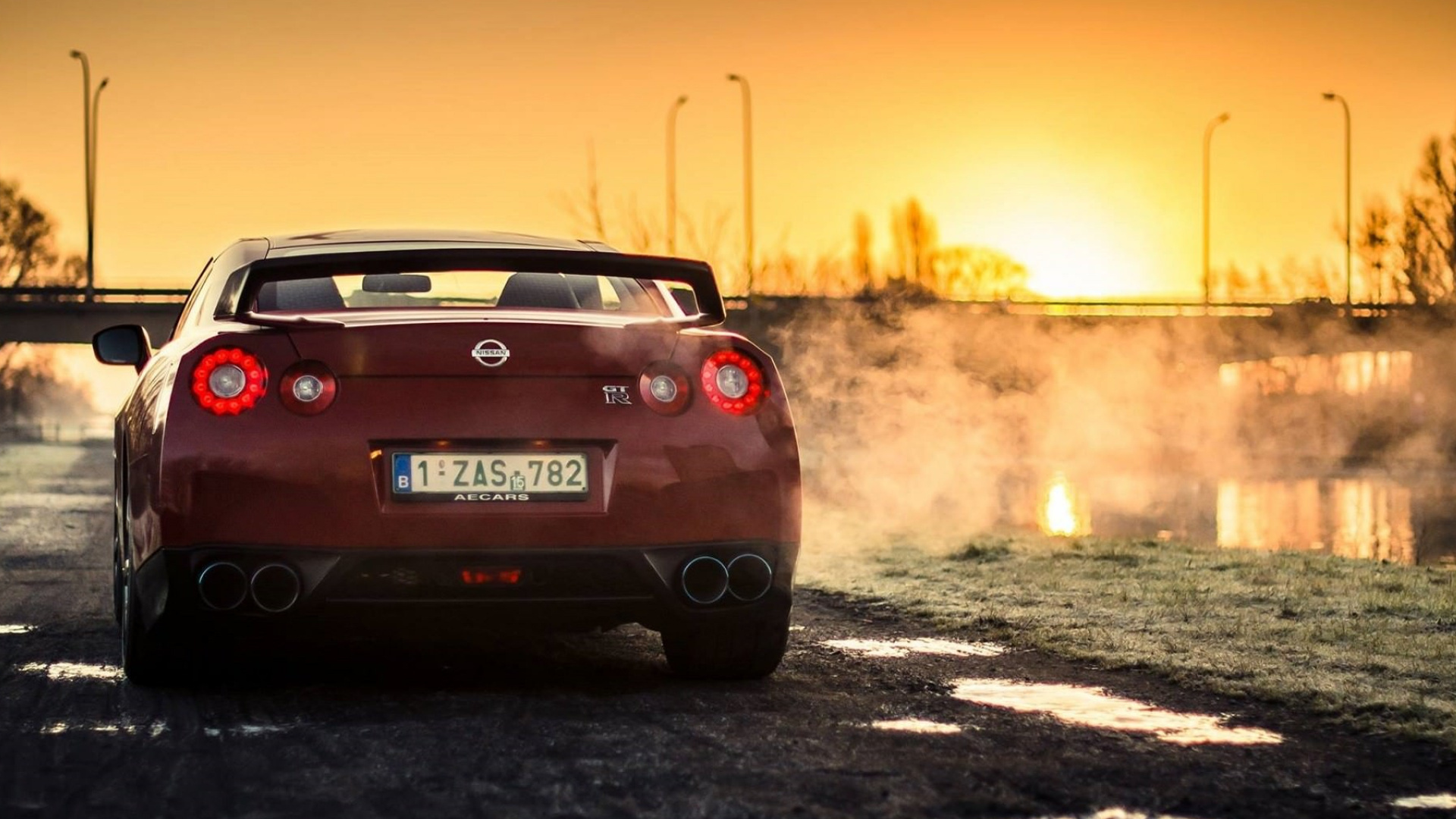 Roter Chevrolet Camaro Unterwegs Bei Sonnenuntergang During. Wallpaper in 1920x1080 Resolution