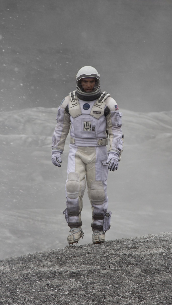 Person in Blue and White Jacket and Pants Standing on Gray Concrete Road During Daytime. Wallpaper in 720x1280 Resolution