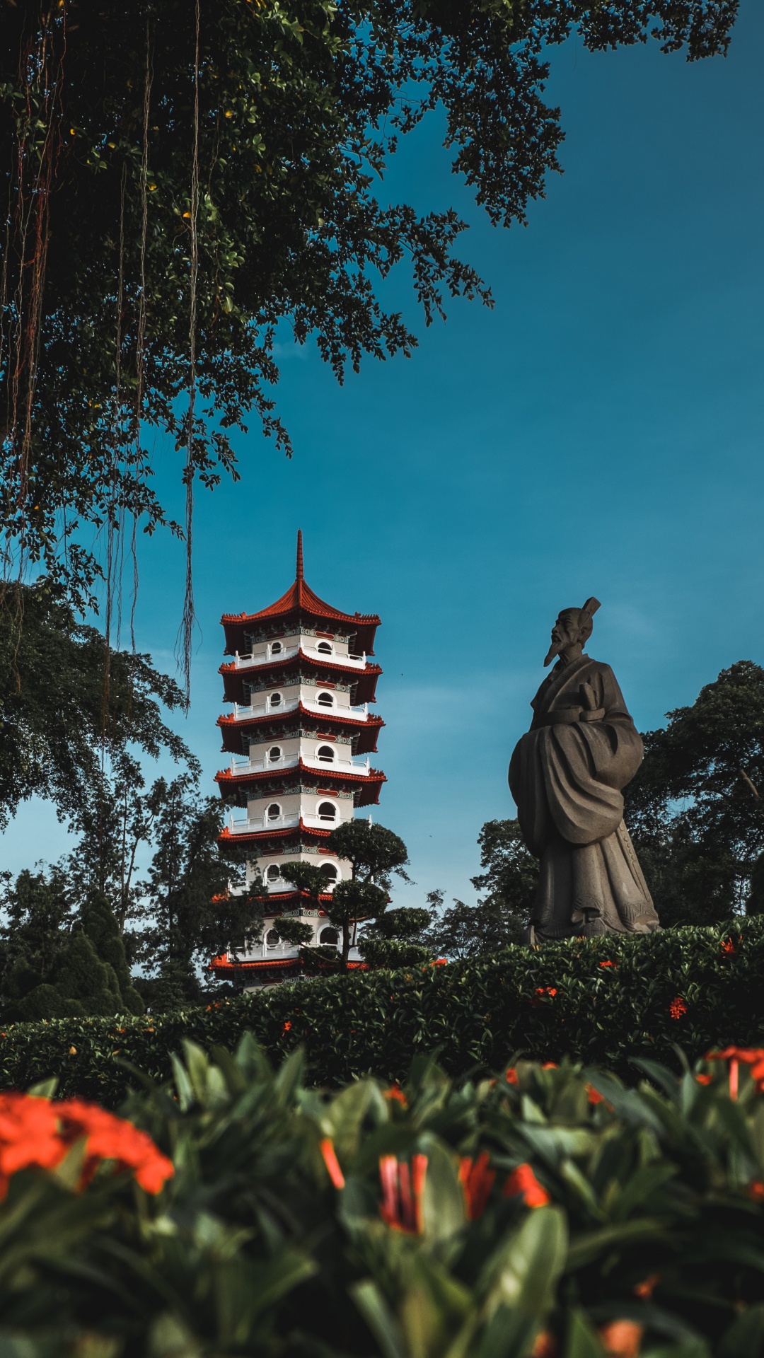 Brown and Black Concrete Statue Near Trees During Daytime. Wallpaper in 1080x1920 Resolution