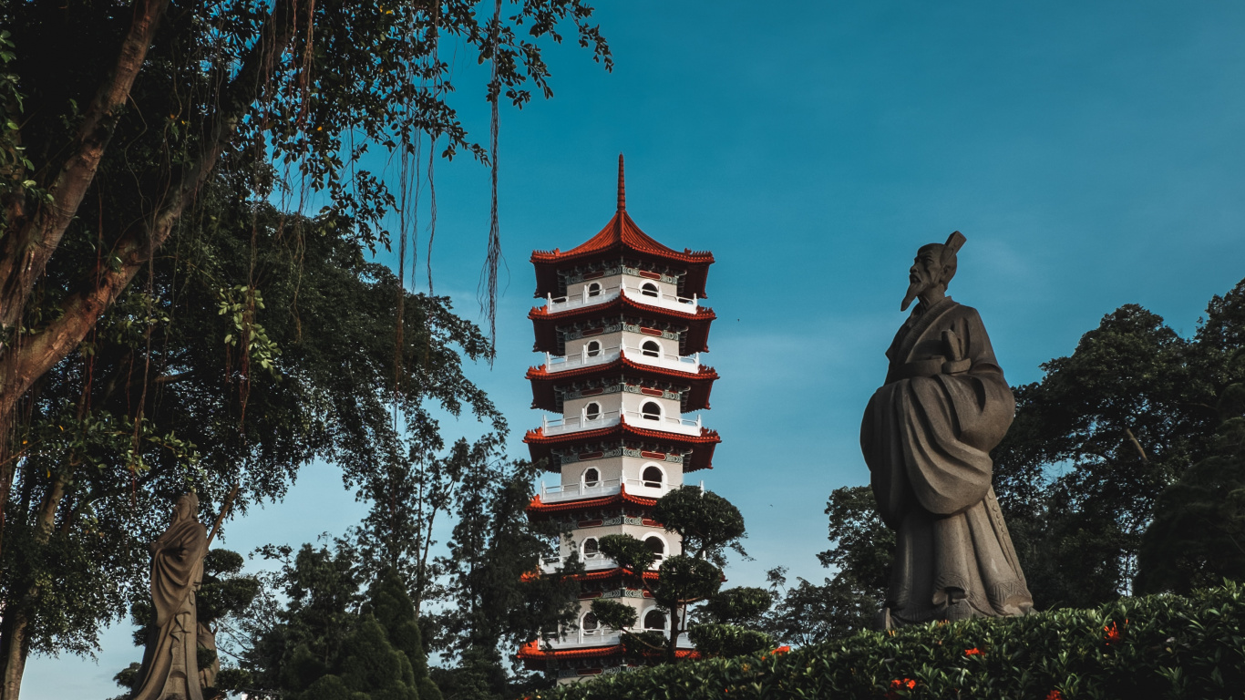 Brown and Black Concrete Statue Near Trees During Daytime. Wallpaper in 1366x768 Resolution