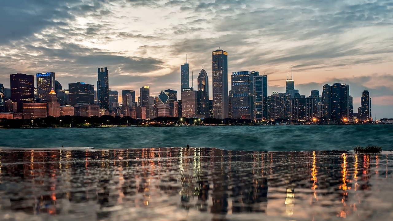 City Skyline Across Body of Water During Daytime. Wallpaper in 1280x720 Resolution
