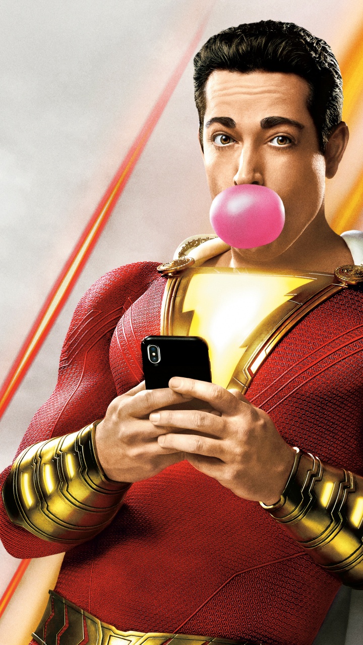 Man in Red Sweater Holding Black Smartphone. Wallpaper in 720x1280 Resolution