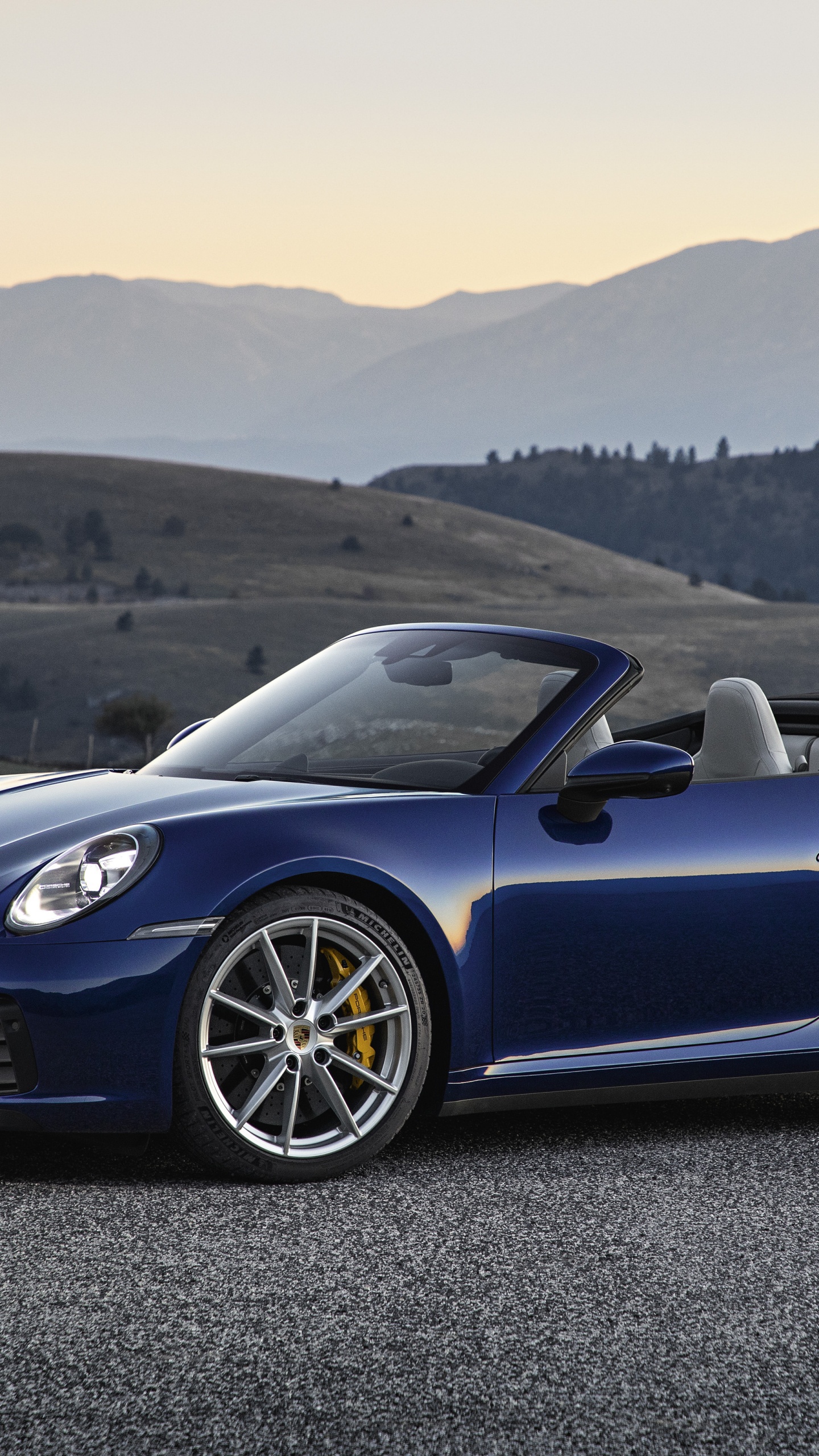 Blue Porsche 911 Convertible Coupe. Wallpaper in 1440x2560 Resolution