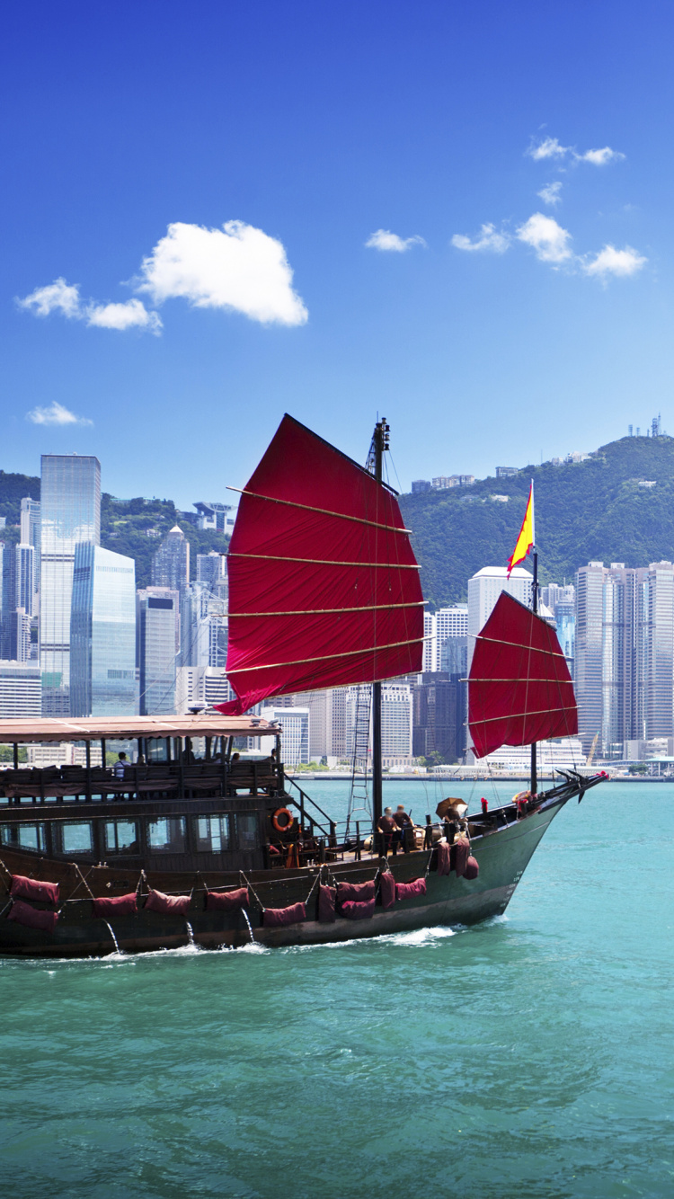 Red and Brown Boat on Sea Near City Buildings During Daytime. Wallpaper in 750x1334 Resolution