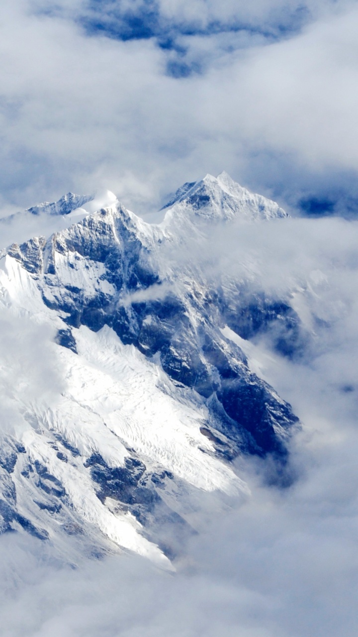 Snow Covered Mountain Under Cloudy Sky During Daytime. Wallpaper in 720x1280 Resolution