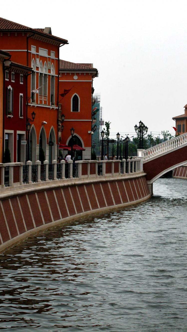 Brown Concrete Bridge Over River. Wallpaper in 750x1334 Resolution