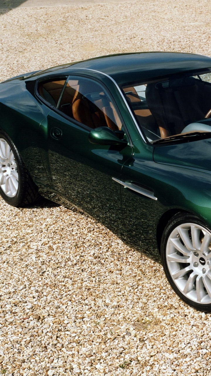 Green Porsche 911 Parked on Gray Concrete Pavement During Daytime. Wallpaper in 720x1280 Resolution