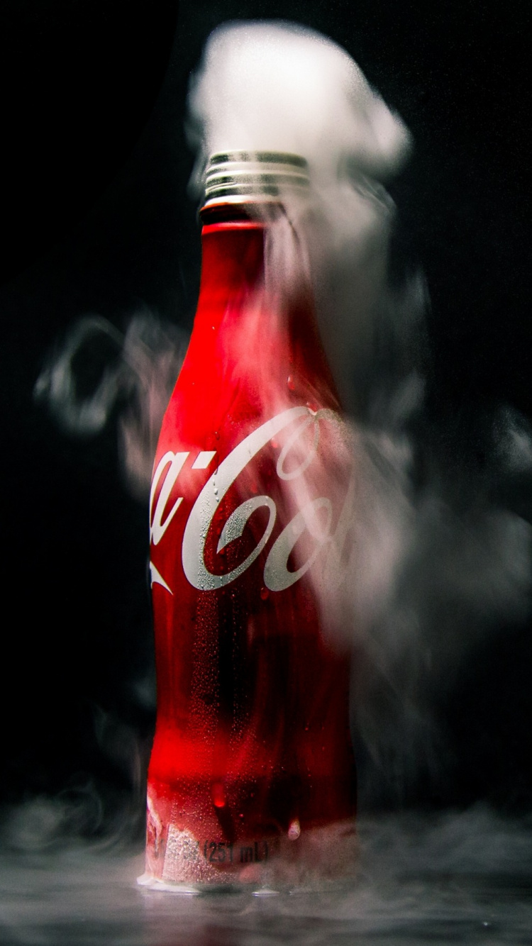 Coca Cola Bottle on Water. Wallpaper in 750x1334 Resolution