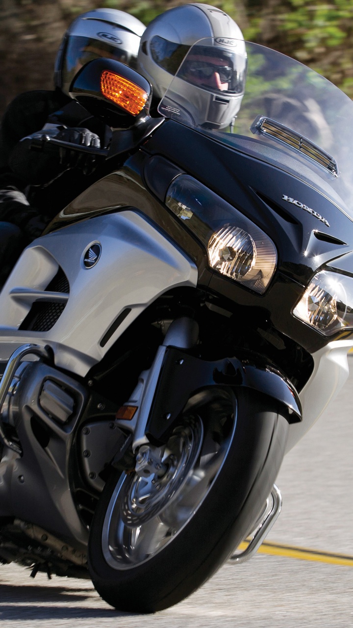 Man in Black Helmet Riding Black Sports Bike. Wallpaper in 720x1280 Resolution