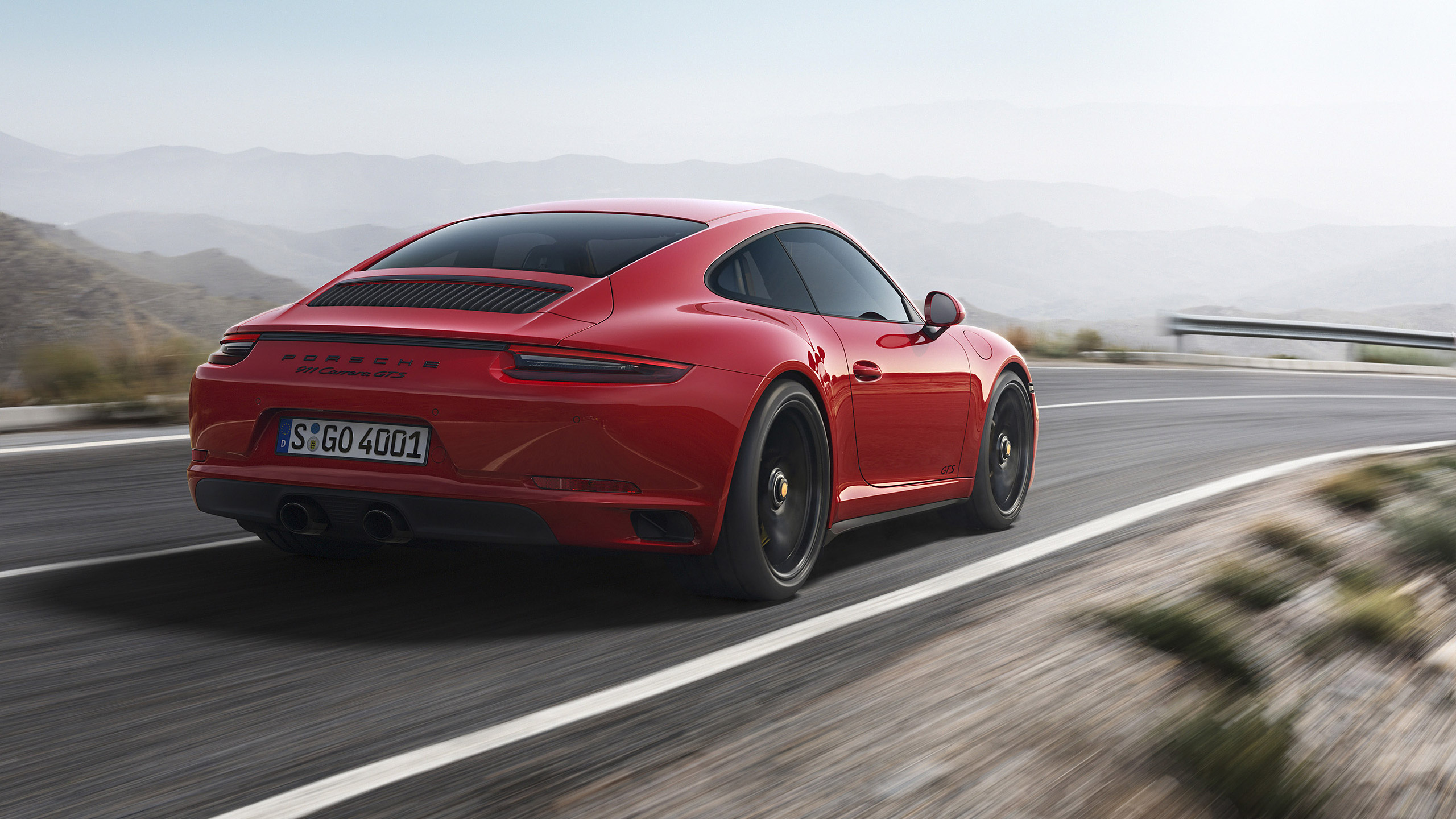 Roter Porsche 911 Tagsüber Unterwegs. Wallpaper in 2560x1440 Resolution