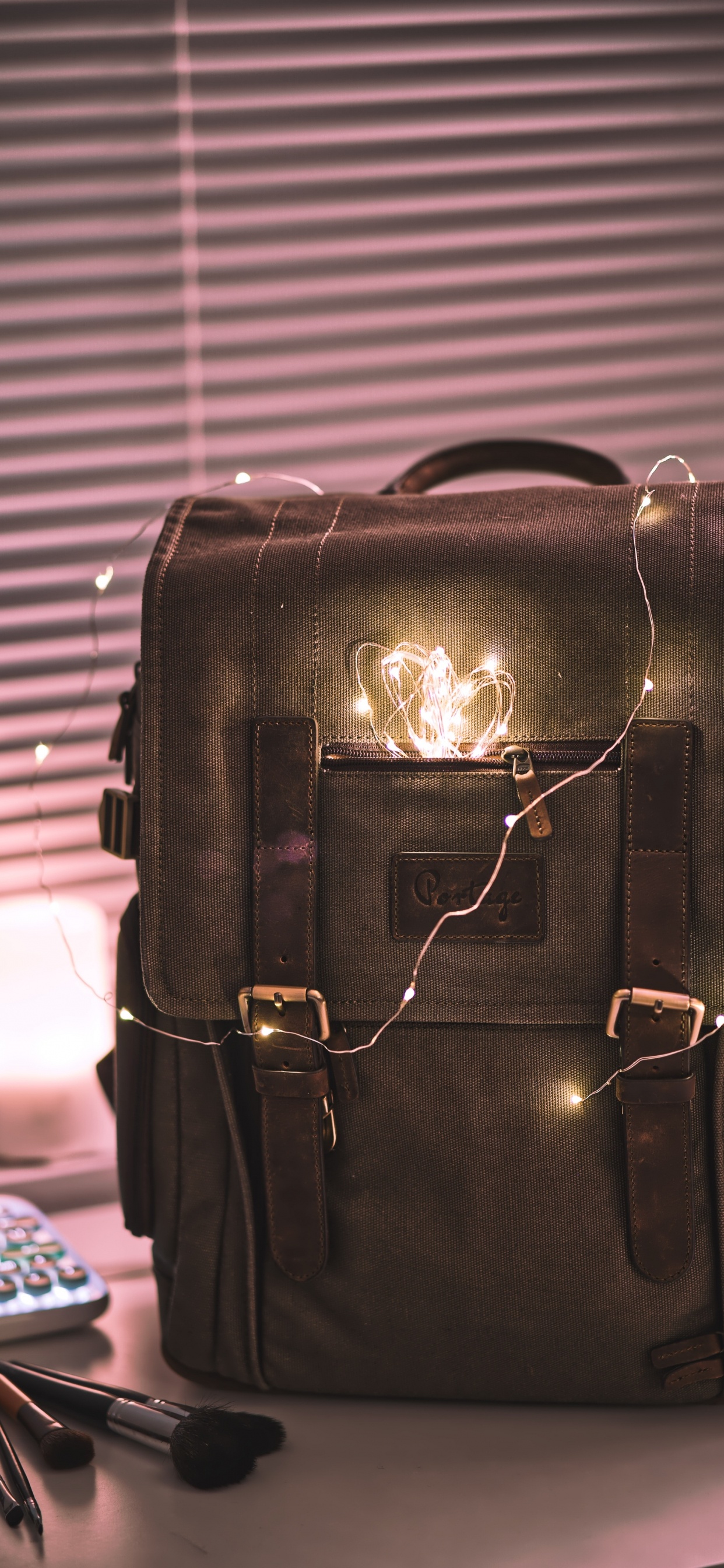 Black Leather Handbag on Table. Wallpaper in 1242x2688 Resolution