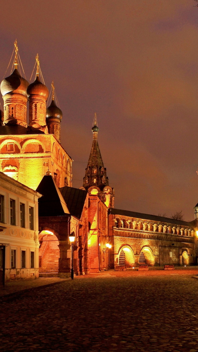 White and Brown Concrete Building During Night Time. Wallpaper in 750x1334 Resolution
