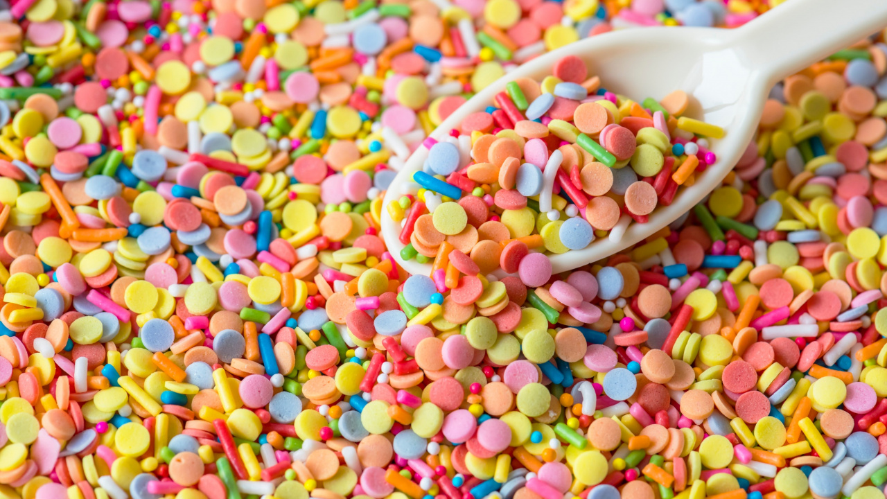 White Ceramic Bowl With Multi Colored Candies. Wallpaper in 1280x720 Resolution